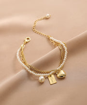 Vogue Gold Metal Alloy Pearl Graphic Love Tassel Charm Bracelet