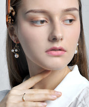 Vogue White Copper Pearl Star Screw Drop Earrings