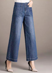 Schöne Jeansblaue Taschen mit hoher Taille, die gerade Hosen aus Baumwolle drapieren