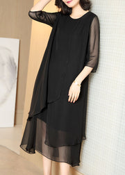 Boutique Schwarzes, aushöhlendes, asymmetrisches Design, Chiffon-Kleider mit halben Ärmeln