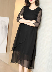 Boutique Schwarzes, aushöhlendes, asymmetrisches Design, Chiffon-Kleider mit halben Ärmeln