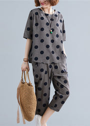 Lässige schwarze O-Neck-Knopf-Karo-Punkt-Baumwolloberseite, elastische Taillenhose, zweiteiliges Set mit halben Ärmeln