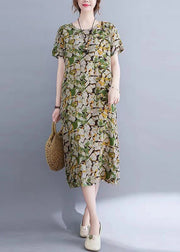 Lässiges grünes O-Neck Print Taschen langes Kleid mit kurzen Ärmeln