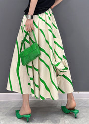 Schicke grün gestreifte elastische Taille asymmetrische lockere Baumwollröcke Sommer