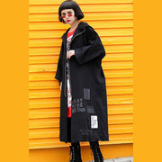Elegante schwarze Mäntel plus Größe Kapuzenmantel Modische lange Jacken mit Reißverschluss und Kordelzug