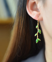 Arbeiten Sie grünes Silber-Gold überzogene eingelegte Jade-Tropfen-Ohrringe um