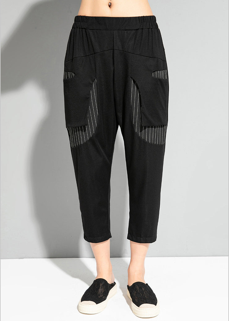 Feine schwarze gestreifte Patchwork-Taschen elastische Taillen-Crop-Hosen Sommer