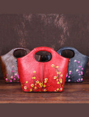 Handtasche aus Kalbsleder mit feinen roten Blumenmustern