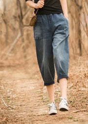 Italienische Denim-Blaue elastische Taille asymmetrische Taschen Baumwoll-Crop-Hosen Sommer
