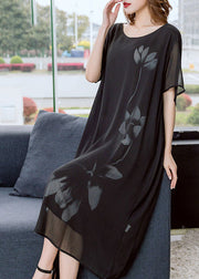 Moderne schwarze O-Neck-Blumendruck-drapierende Chiffon-Kleider mit kurzen Ärmeln