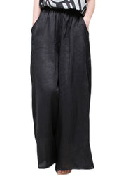 Moderne, schwarze Taschen, bestickte Blumen, elastische Taille, Leinenhose mit weitem Bein, Sommer