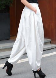 Moderne, weiße, elastische Taillentaschen, asymmetrisches Design, Frühlingshose
