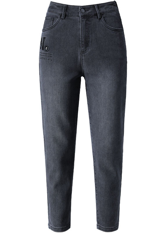 Schmal geschnittene, schwarze Jeanshose mit hoher Taille und Reißverschlusstaschen