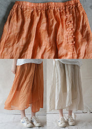 Style Orange elastischer Taillenknopf Asymmetrische Leinenröcke Frühling