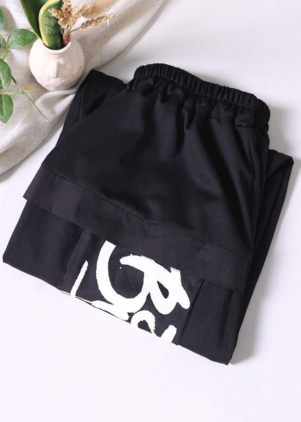 Stilvolle schwarze elastische Taillentaschen Briefdruck Baumwolle Streetwear Haremshose Sommer