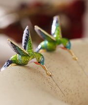 Stilvolle Creolen aus Metall mit grünem Vogel