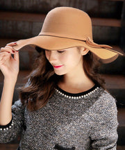 Stylish Mulberry Wave Brim Bow Woolen Cloche Hat