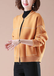 Stilvolle orangefarbene O-Neck-Taschen mit Reißverschluss und bedruckten Strickmänteln mit langen Ärmeln