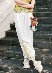 Weiße Taschen mit Kordelzug, elastische Taille, Laternenhose im Herbst