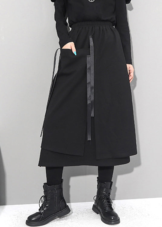 Frauen schwarze asymmetrische Patchwork-Taschen elastische Taillenröcke Herbst