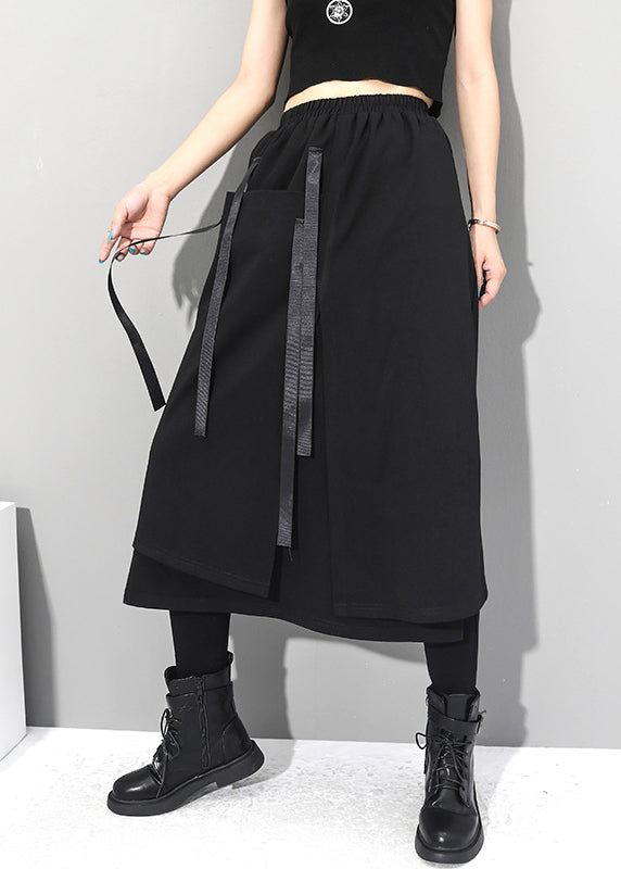 Frauen schwarze asymmetrische Patchwork-Taschen elastische Taillenröcke Herbst