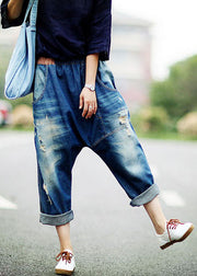 Frauen dunkelblaue asymmetrische Taschen elastische Taille zerrissene Jeans Frühling