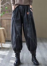 Vintage schwarze elastische Taille Taschen Denim Hosen Frühling