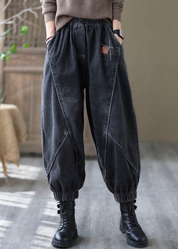 Vintage schwarze elastische Taille Taschen Denim Hosen Frühling